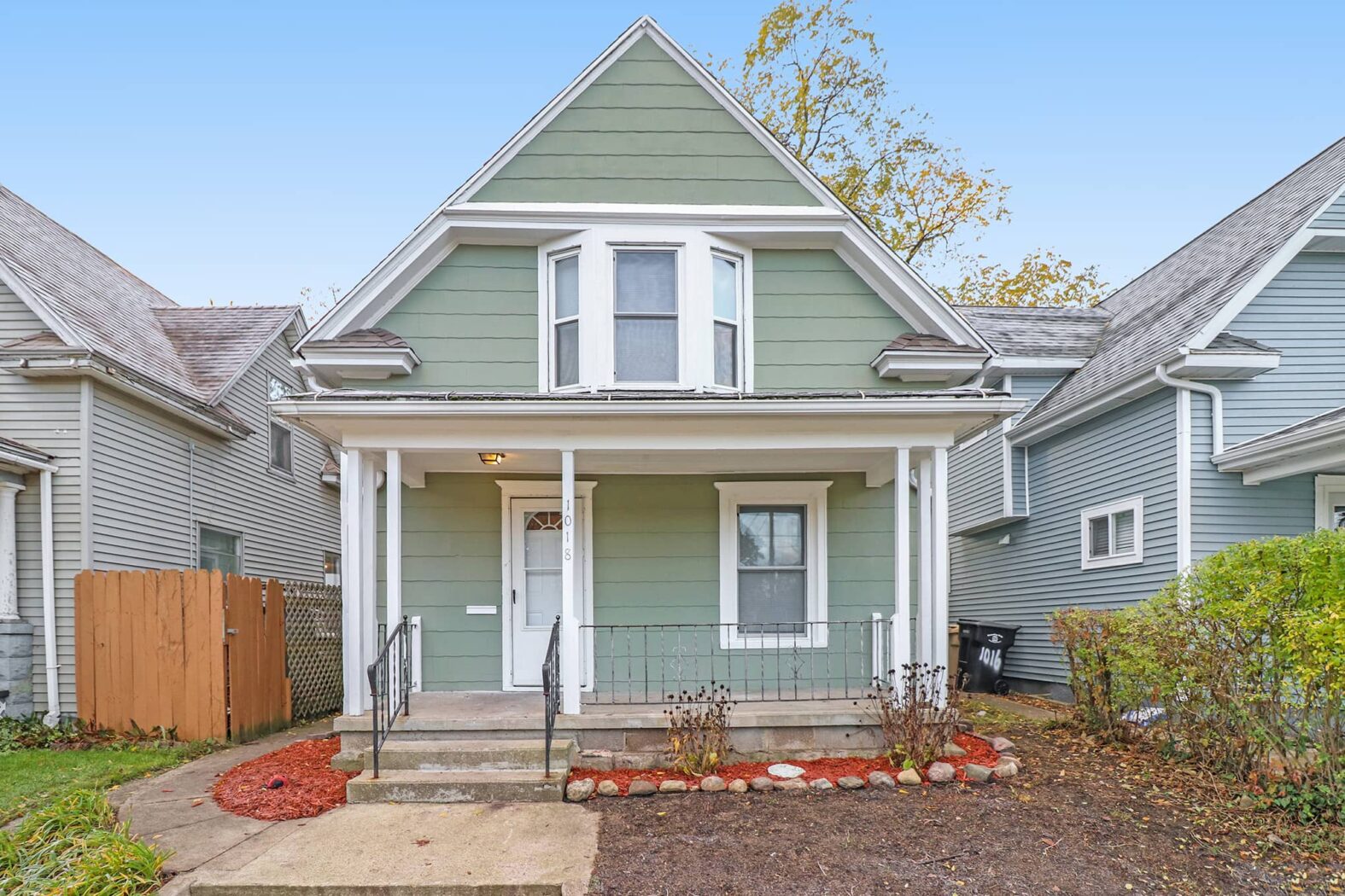 Green house with porch