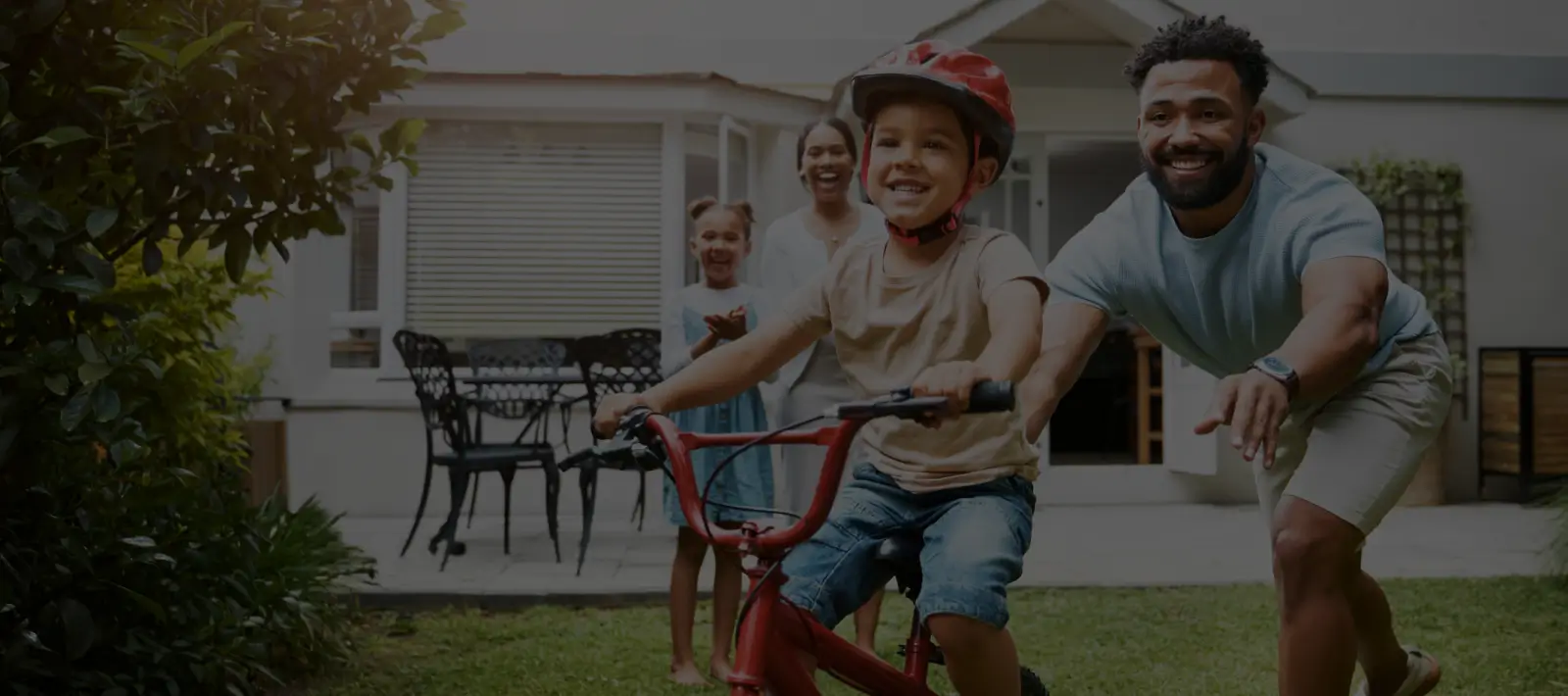 Young boy riding a bicycle.